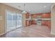 Well-lit kitchen with stainless steel appliances and sliding door to screened-in porch at 339 Cicadas Song, Moncks Corner, SC 29461