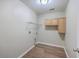 Clean laundry room with washer/dryer hookups and storage cabinets at 339 Cicadas Song, Moncks Corner, SC 29461