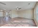 Spacious living room with hardwood floors, neutral walls, a ceiling fan and a view into the dining room at 339 Cicadas Song, Moncks Corner, SC 29461