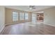Open-concept living room with wood floors and large windows for natural light at 339 Cicadas Song, Moncks Corner, SC 29461