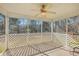 Inviting screened porch with a ceiling fan and views of the wooded backyard at 339 Cicadas Song, Moncks Corner, SC 29461