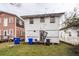 Rear view of two-story house with weathered siding and a small yard at 355 Nassau St, Charleston, SC 29403