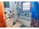 Outdated bathroom needing renovation, featuring colorful tiles and aged fixtures at 355 Nassau St, Charleston, SC 29403