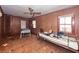 Bedroom with wood paneling, ceiling fan, windows and assorted furniture at 355 Nassau St, Charleston, SC 29403