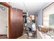 Bedroom shows signs of neglect; closet, personal items and peeling paint visible, in need of repair at 355 Nassau St, Charleston, SC 29403