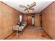 Bedroom with wood paneling, ceiling fan, windows, closet and assorted furniture at 355 Nassau St, Charleston, SC 29403