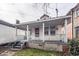 House with inviting porch and weathered features, needing TLC at 355 Nassau St, Charleston, SC 29403