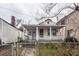 Charming home requiring updates featuring a cozy porch and a small front yard at 355 Nassau St, Charleston, SC 29403