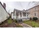 Cottage-style home needing renovation featuring a covered porch and weathered facade at 355 Nassau St, Charleston, SC 29403