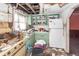 Kitchen area with damage to the ceiling and missing cabinets, needing repair at 355 Nassau St, Charleston, SC 29403