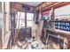 Sunroom with exposed frame, many windows and accumulated debris at 355 Nassau St, Charleston, SC 29403