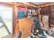 Room with exposed frame, many windows, discarded bike and accumulated debris at 355 Nassau St, Charleston, SC 29403