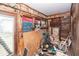 Sun room with exposed wooden beams and open window frames; damage and repairs needed at 355 Nassau St, Charleston, SC 29403