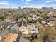 A high-angle shot showcases a neighborhood with a diverse array of colorful homes and city views at 42 Kennedy St, Charleston, SC 29403