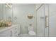 Bathroom featuring double sinks, white vanity, gold hardware and fixtures, and decorative mirror at 42 Kennedy St, Charleston, SC 29403