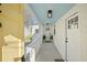 Covered entryway with a light blue ceiling, a 