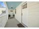 Inviting front porch with double doors and a blue ceiling, enhancing curb appeal at 42 Kennedy St, Charleston, SC 29403