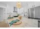 Modern kitchen featuring stainless steel appliances, a large marble countertop island, and ample white cabinetry at 42 Kennedy St, Charleston, SC 29403