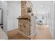 Bright living room with a brick fireplace, hardwood floors, and stylish furniture at 42 Kennedy St, Charleston, SC 29403