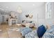 Bright living room featuring a brick fireplace, hardwood floors, a stylish chandelier, and tasteful furnishings at 42 Kennedy St, Charleston, SC 29403