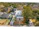 Aerial view of a two-story home with a front porch, white picket fence, and landscaped yard in a neighborhood at 425 Mccants Dr, Mount Pleasant, SC 29464