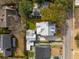 Overhead view showcasing a home with a modern roof and fenced yard in a neighborhood with tree coverage at 425 Mccants Dr, Mount Pleasant, SC 29464