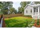 Lush artificial grass in a backyard with well-maintained landscaping and horizontal wood fence at 425 Mccants Dr, Mount Pleasant, SC 29464