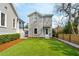 Artificial grass lawn and the back side of a gray two-story house at 425 Mccants Dr, Mount Pleasant, SC 29464