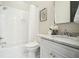 Clean bathroom featuring a tub with shower, white subway tile, and marble vanity at 425 Mccants Dr, Mount Pleasant, SC 29464