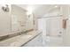 Traditional bathroom featuring a granite countertop, a framed mirror, and a shower-over-tub combo at 425 Mccants Dr, Mount Pleasant, SC 29464