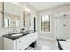 Bright bathroom featuring double vanity, granite countertops, and a glass enclosed shower at 425 Mccants Dr, Mount Pleasant, SC 29464