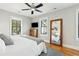 Serene bedroom with natural light, dresser, large mirror, and hardwood floors at 425 Mccants Dr, Mount Pleasant, SC 29464
