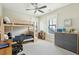 A bedroom with bunkbeds, natural light, and a ceiling fan at 425 Mccants Dr, Mount Pleasant, SC 29464