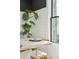 Bright dining area showcasing a table setting, large windows, and a leafy plant at 425 Mccants Dr, Mount Pleasant, SC 29464