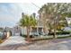Classic two-story house with a front porch, dormer windows, a detached garage, and a tidy front lawn at 425 Mccants Dr, Mount Pleasant, SC 29464