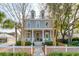 Inviting two-story home featuring dormer windows, a cozy front porch, and a well-manicured front yard at 425 Mccants Dr, Mount Pleasant, SC 29464