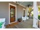 Cozy front porch with rocking chairs, a wooden door, a painted ceiling, and views of the neighborhood at 425 Mccants Dr, Mount Pleasant, SC 29464