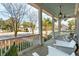 Welcoming front porch with white chairs, blue ceiling, and a view of the landscaped front yard at 425 Mccants Dr, Mount Pleasant, SC 29464