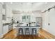 Bright kitchen with white cabinets, stainless steel appliances, and large island with seating at 425 Mccants Dr, Mount Pleasant, SC 29464