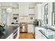 Charming kitchen with marble backsplash, stainless steel appliances, and dark countertops at 425 Mccants Dr, Mount Pleasant, SC 29464