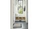 Functional mudroom with built-in bench, storage baskets, and a sunlit window at 425 Mccants Dr, Mount Pleasant, SC 29464