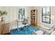 Bright office space with desk, bookshelves, and comfortable seating at 425 Mccants Dr, Mount Pleasant, SC 29464