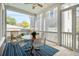 Cozy screened porch with outdoor dining and seating, perfect for relaxing at 425 Mccants Dr, Mount Pleasant, SC 29464