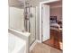 Bathroom featuring a shower, tub and view of a bedroom with wood floors and a large bed at 426 Mountain Laurel Cir, Goose Creek, SC 29445