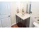 Powder room features a stylish vanity with a white countertop and dark wood cabinets at 426 Mountain Laurel Cir, Goose Creek, SC 29445