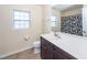 Bathroom featuring a vanity with sink, toilet, mirror and window for natural light at 426 Mountain Laurel Cir, Goose Creek, SC 29445