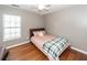 Bedroom boasts hardwood floors, a ceiling fan and a window providing ample natural light at 426 Mountain Laurel Cir, Goose Creek, SC 29445