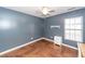 Bedroom features herringbone floors, a ceiling fan, a window, and a nightstand at 426 Mountain Laurel Cir, Goose Creek, SC 29445