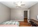 Bedroom featuring a bed, ceiling fan, desk and a doorway leading to another room at 426 Mountain Laurel Cir, Goose Creek, SC 29445