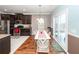 An eat-in kitchen boasts dark wood cabinets, stainless steel appliances, tile floors and wood floors in the dining area at 426 Mountain Laurel Cir, Goose Creek, SC 29445